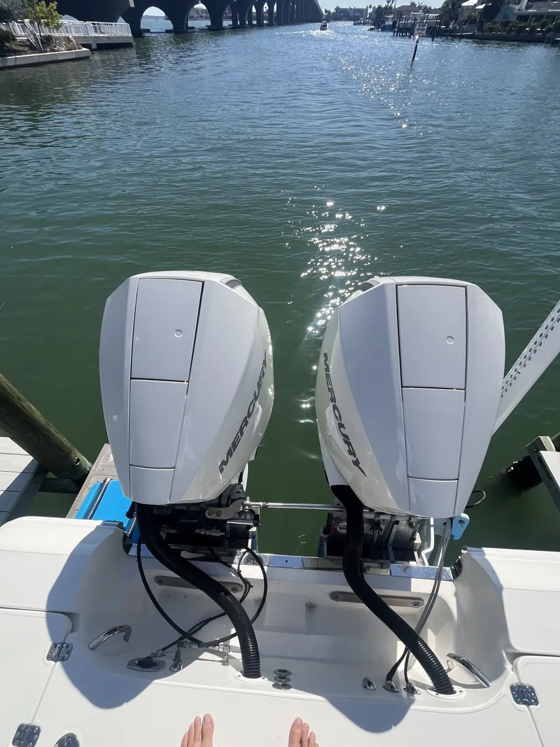 Slide: The Image of ShearWater Carolina 2020 with twin Mercury engines on calm water. - 12
