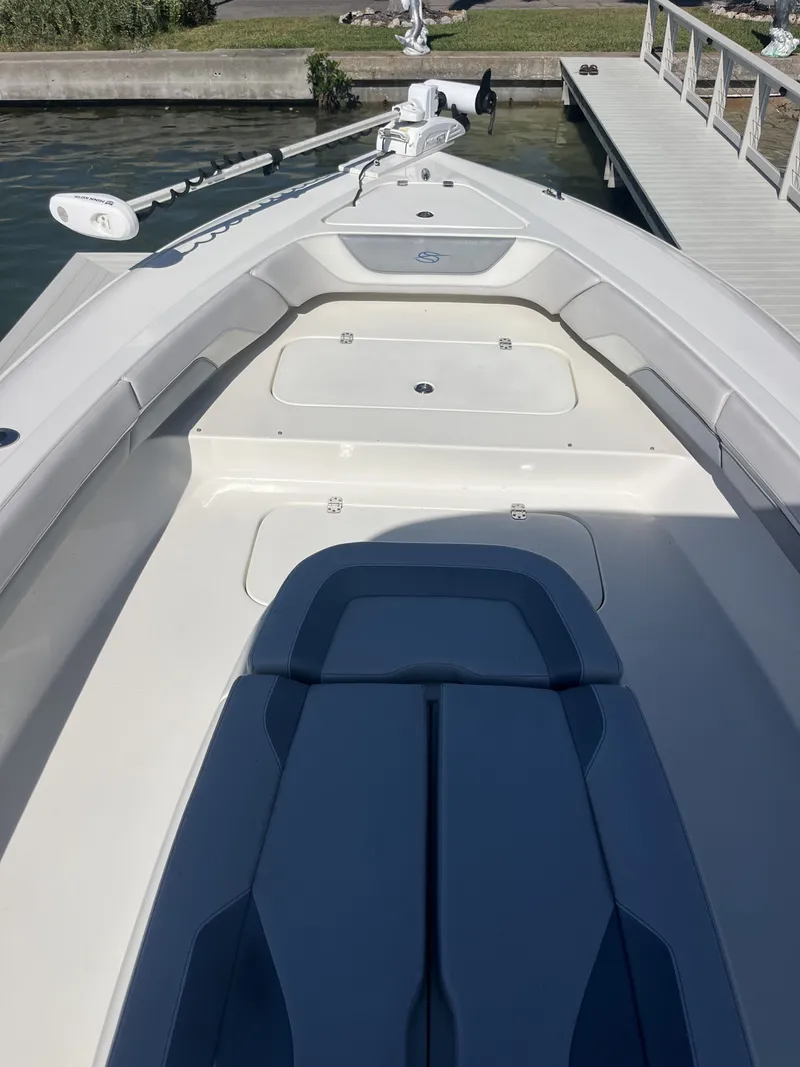 Slide: The Image of 2020 ShearWater Carolina boat deck with seating area at dock. - 16