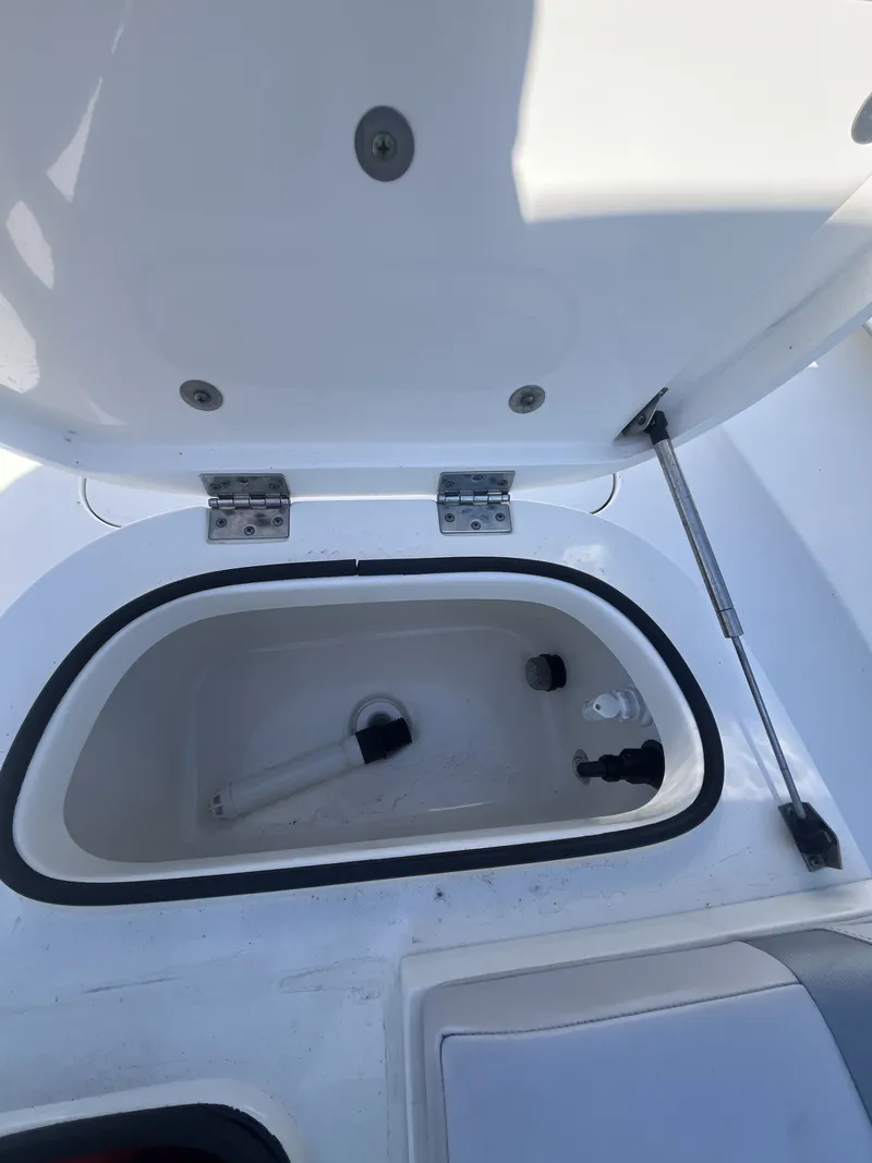 Slide: The Image of Open storage compartment on a 2020 ShearWater Carolina boat. - 23