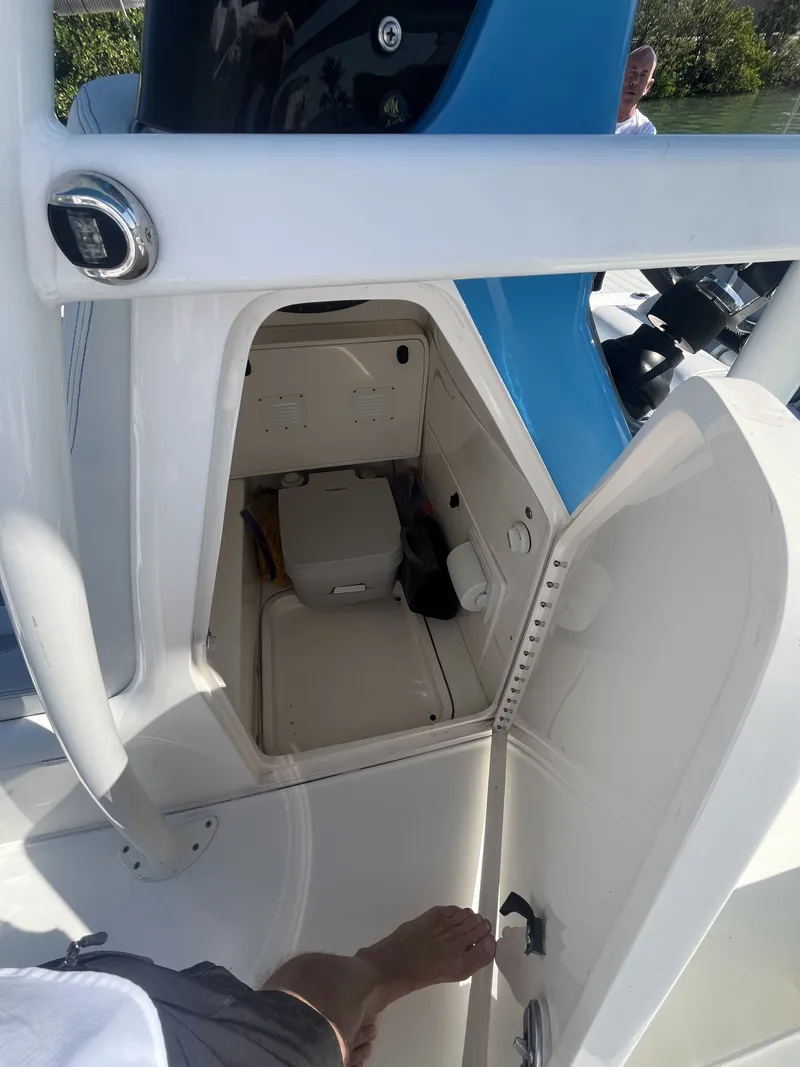 Slide: The Image of Interior of a 2020 ShearWater Carolina boat with open compartment door. - 25