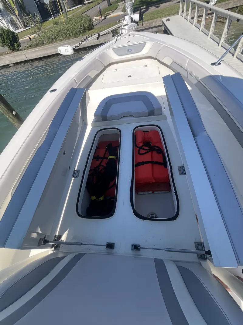 Slide: The Image of ShearWater Carolina 2020 boat with storage and life jackets. - 28