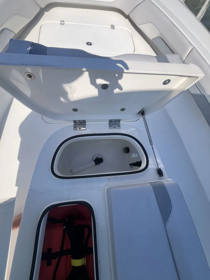 Slide: The Image of Interior view of a 2020 ShearWater Carolina boat with storage compartment. - 31