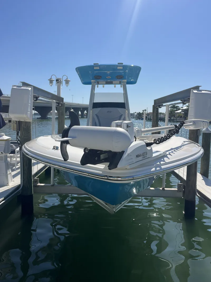 Slide: The Image of ShearWater Carolina 2020 boat docked under sunny skies. - 32