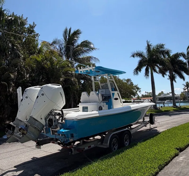 Slide: The Image of 2020 ShearWater Carolina boat on trailer, palm trees in background. - 36