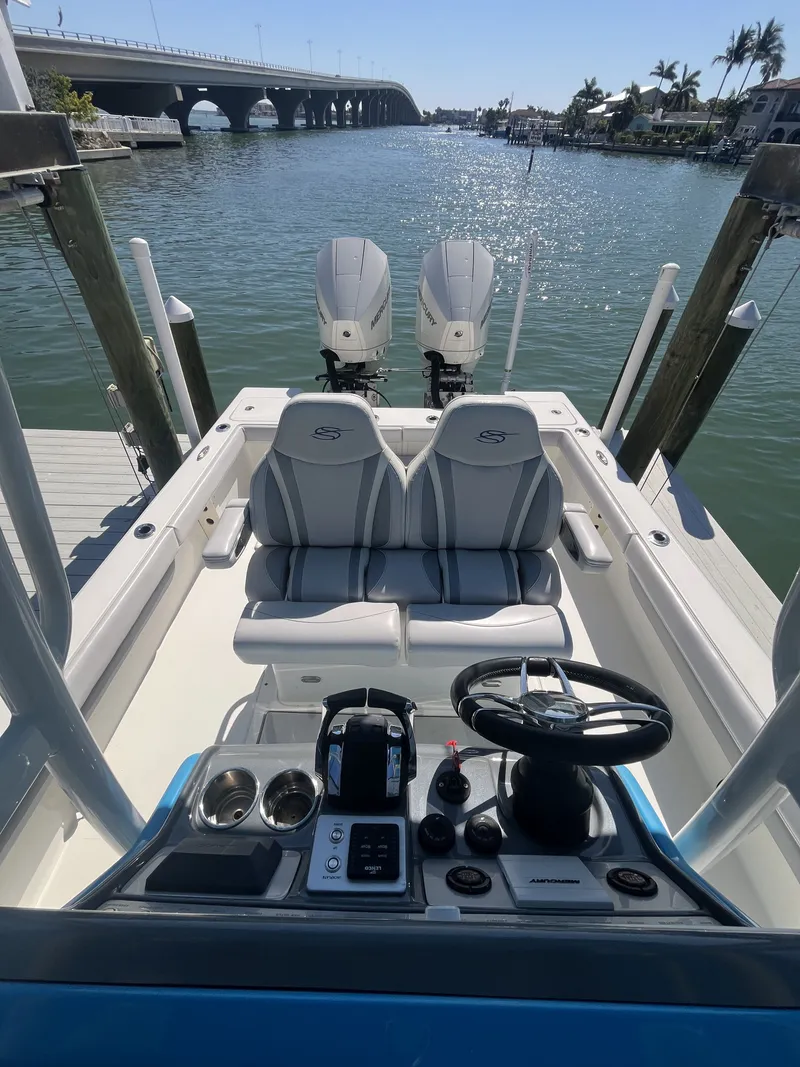 Slide: The Image of ShearWater Carolina 2020 boat with dual engines on calm water. - 8