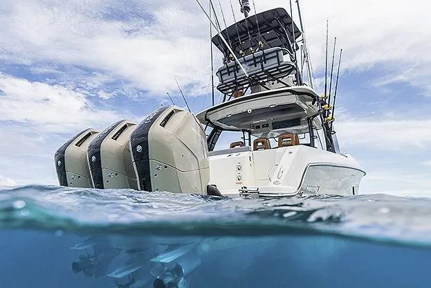Slide: The Image of Manufacturer Provided Image: 2025 Boston Whaler 420 Outrage with multiple outboard engines on the ocean. - 3