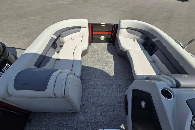 Slide: The Image of 2024 Barletta C22UC pontoon boat interior with plush seating and modern design. - 8