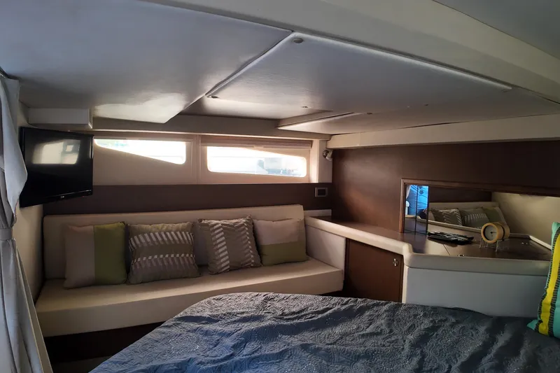Slide: The Image of Interior of 2015 Sea Ray 370 Venture yacht with cozy seating and modern decor. - 10