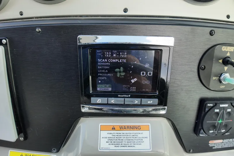 Slide: The Image of 2015 Sea Ray 370 Venture dashboard with VesselView4 display and control panel. - 4