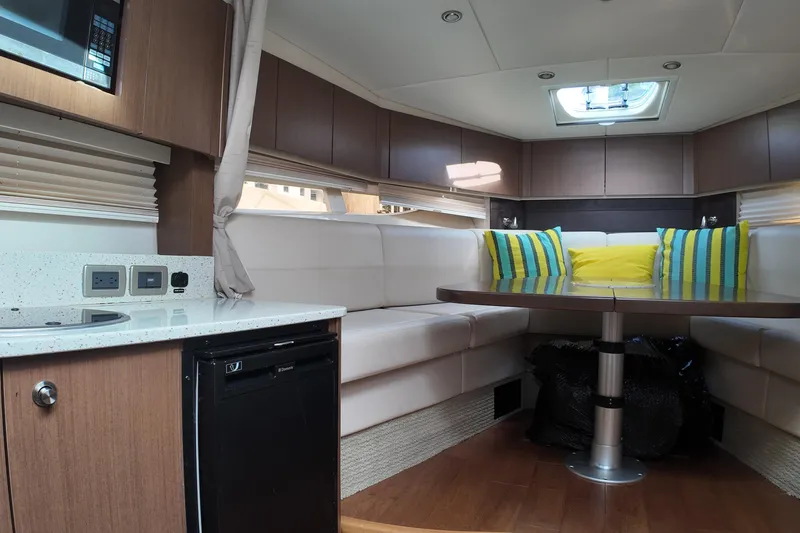 Slide: The Image of Luxurious interior of 2015 Sea Ray 370 Venture yacht with modern seating and vibrant cushions. - 6