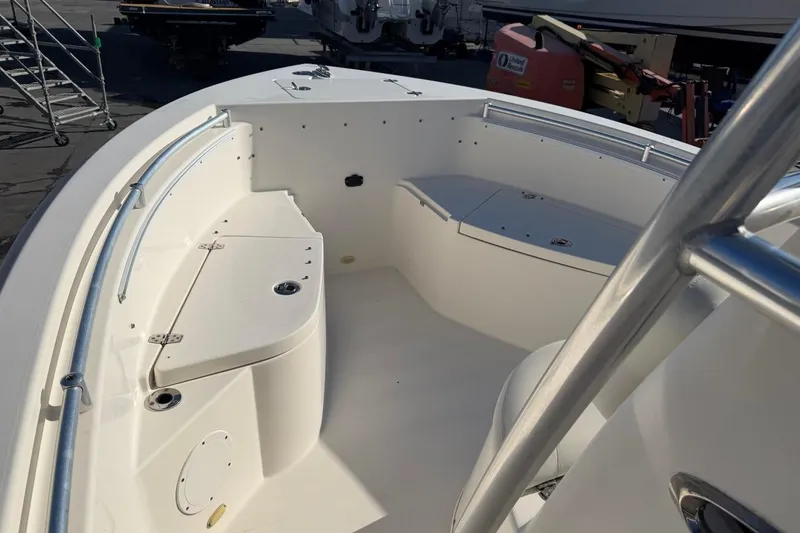 Slide: The Image of 2018 Cobia 220 Center Console boat interior with seating and storage compartments. - 10