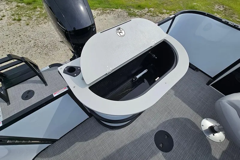 Slide: The Image of 2026 Bentley Pontoons 243 FNC boat deck with storage compartment and motor. - 13