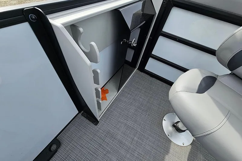 Slide: The Image of 2026 Bentley Pontoons 243 FNC interior storage compartment with seating and carpeted flooring. - 15