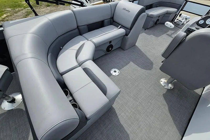 Slide: The Image of Luxurious interior of 2026 Bentley Pontoons 243 FNC with plush gray seating. - 16