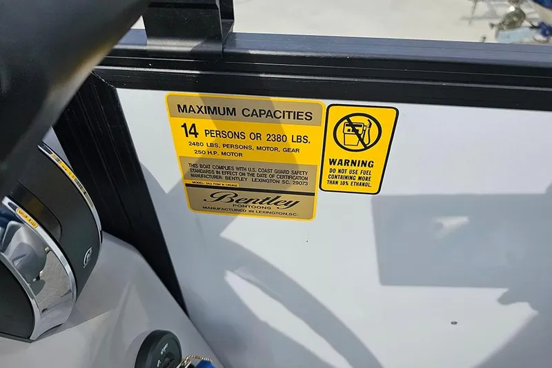 Slide: The Image of 2026 Bentley Pontoons 243 FNC capacity label, 14 persons or 2380 lbs, ethanol warning. - 20