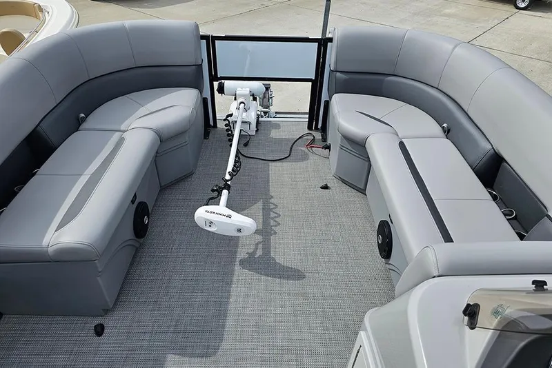 Slide: The Image of 2026 Bentley Pontoons 243 FNC interior with gray seating and trolling motor. - 22