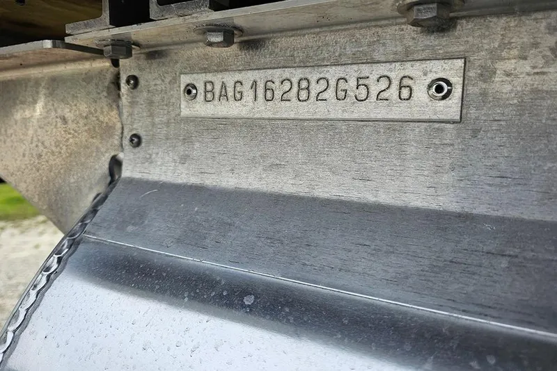Slide: The Image of 2026 Bentley Pontoons 243 FNC hull identification number plate close-up. - 26