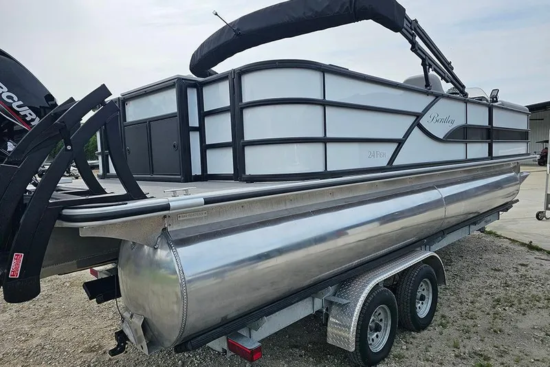 Slide: The Image of 2026 Bentley Pontoons 243 FNC Fish N Cruise on trailer, side view. - 3