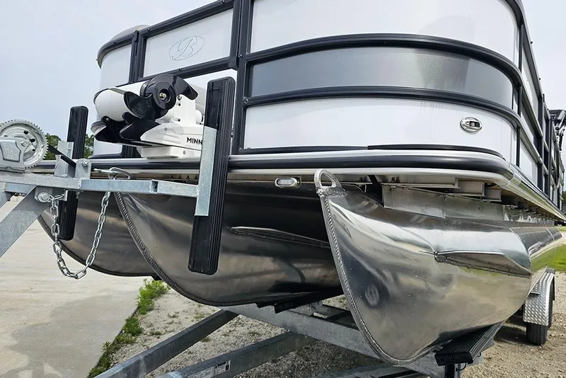 Slide: The Image of 2026 Bentley Pontoons 243 FNC on trailer, showcasing sleek design and sturdy construction. - 6