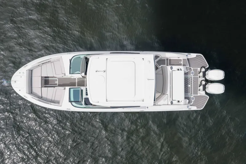 Slide: The Image of Top view of 2023 Sea Ray SLX 350 Outboard boat on water. - 16