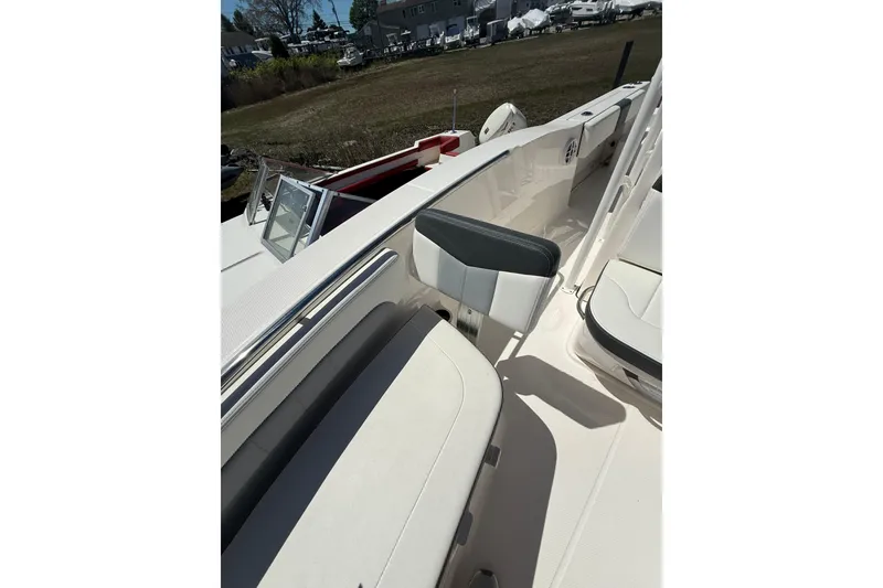 Slide: The Image of 2023 Robalo R202 Explorer boat interior with seating and open deck view. - 14