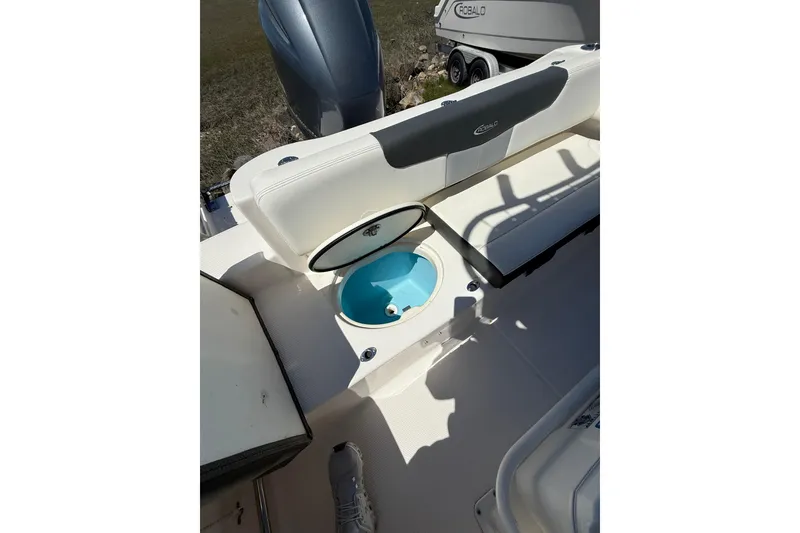 Slide: The Image of 2023 Robalo R202 Explorer boat interior with open storage compartment. - 21