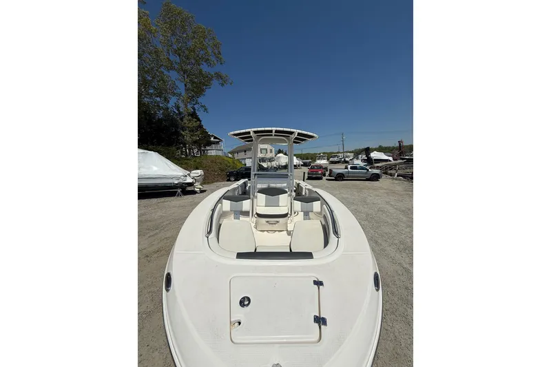Slide: The Image of 2023 Robalo R202 Explorer boat on display in outdoor showroom. - 24