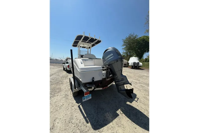 Slide: The Image of 2023 Robalo R202 Explorer boat with Yamaha outboard motor on a trailer. - 5