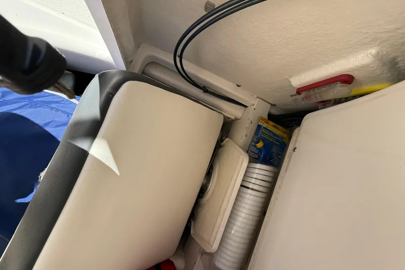 Slide: The Image of Interior view of 2023 Robalo R202 Explorer boat storage compartment. - 7