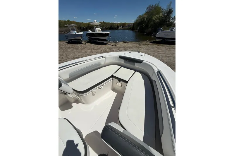 Slide: The Image of 2023 Robalo R202 Explorer boat interior with spacious seating and sleek design. - 8