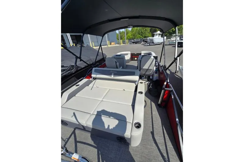 Slide: The Image of 2024 Barletta C22UC pontoon boat interior with seating and canopy. - 4
