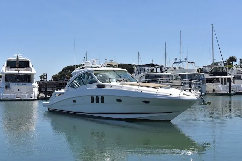 The Image of 2007 Sea Ray 48 Sundancer yacht docked in marina. - 0