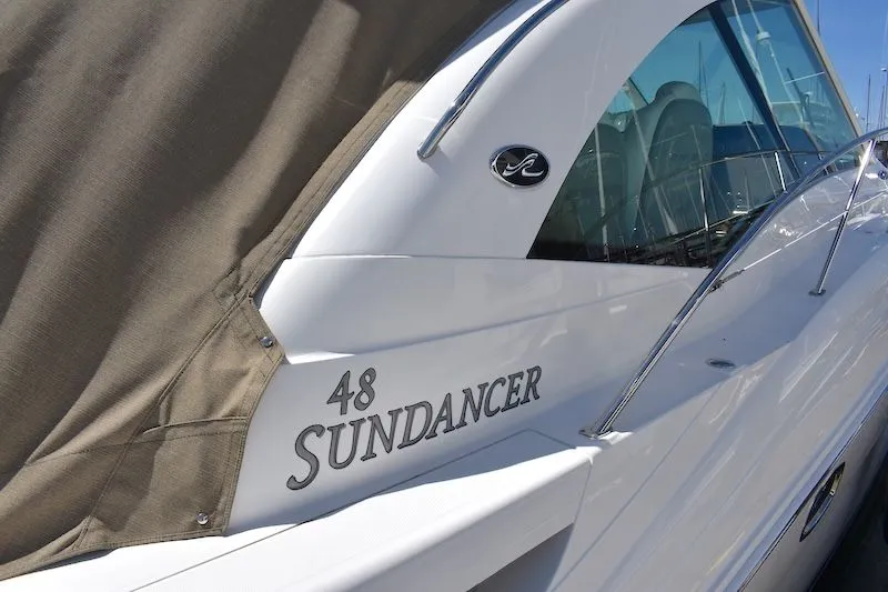 Slide: The Image of 2007 Sea Ray 48 Sundancer yacht side view with cover. - 10