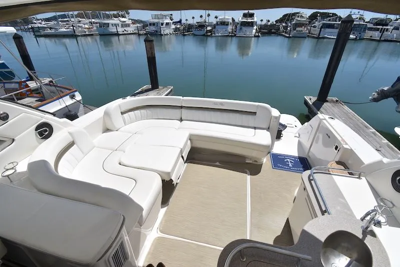 Slide: The Image of 2007 Sea Ray 48 Sundancer with spacious cockpit at marina. - 12