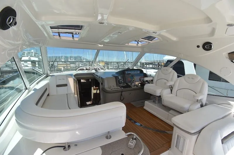 Slide: The Image of Interior of a 2007 Sea Ray 48 Sundancer yacht with luxurious white seating. - 13