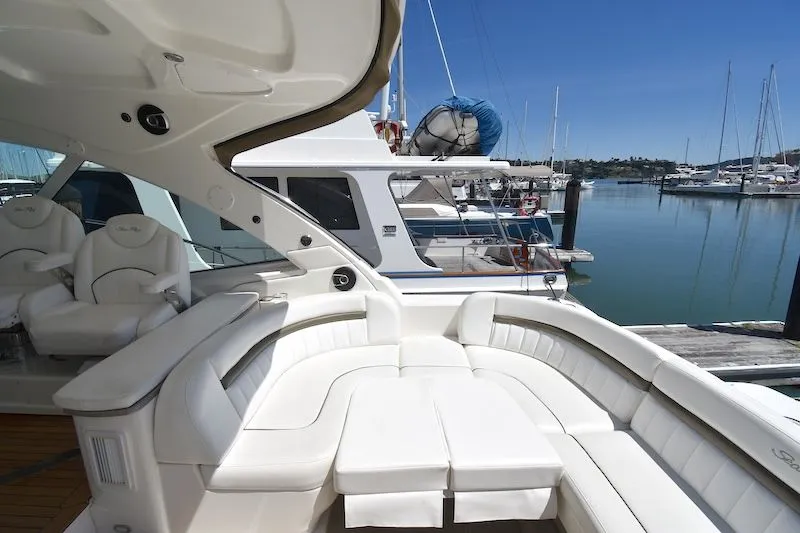 Slide: The Image of 2007 Sea Ray 48 Sundancer yacht with luxurious white interior at the marina. - 18