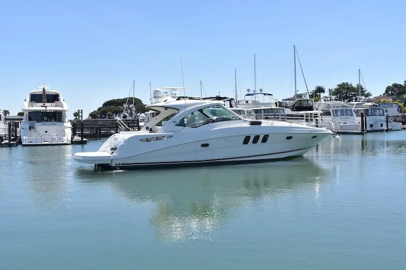 Slide: The Image of 2007 Sea Ray 48 Sundancer yacht docked in marina. - 2