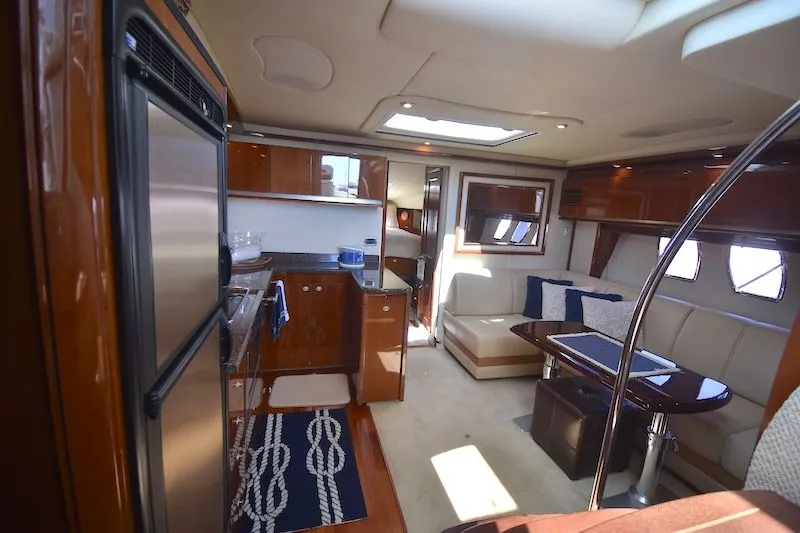 Slide: The Image of Interior of 2007 Sea Ray 48 Sundancer with elegant kitchen and seating area. - 21