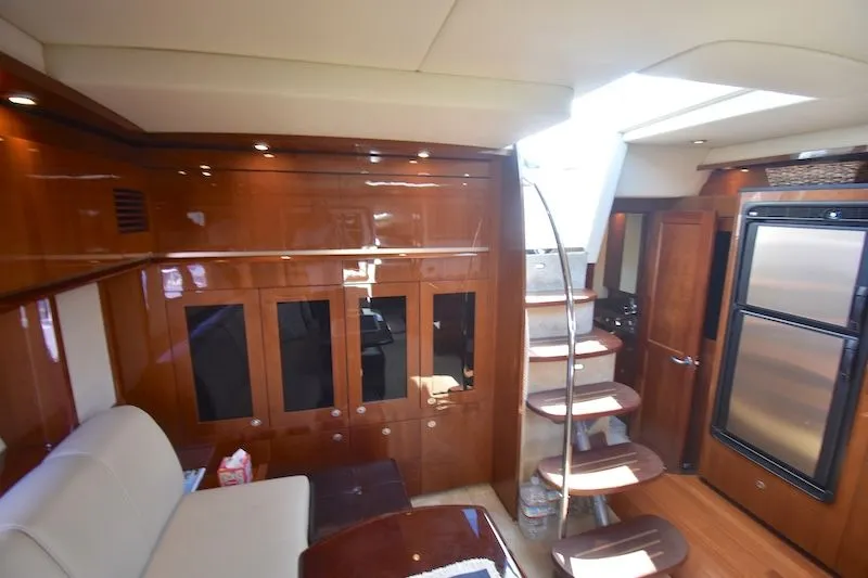 Slide: The Image of Interior of 2007 Sea Ray 48 Sundancer with wood paneling and staircase. - 23