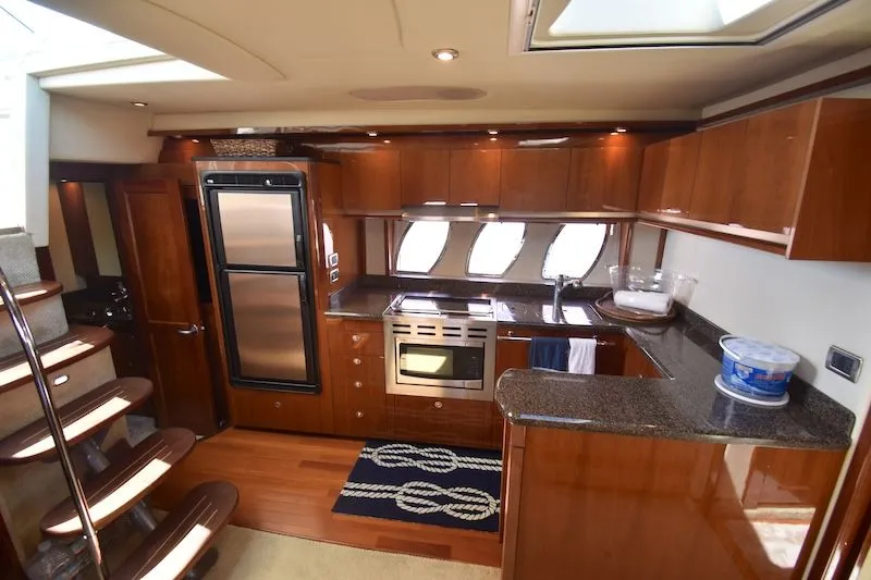 Slide: The Image of Interior of 2007 Sea Ray 48 Sundancer featuring modern kitchen. - 24