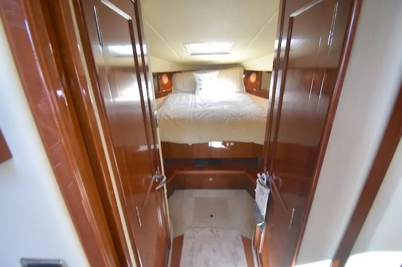 Slide: The Image of Interior of 2007 Sea Ray 48 Sundancer featuring cozy bedroom. - 30