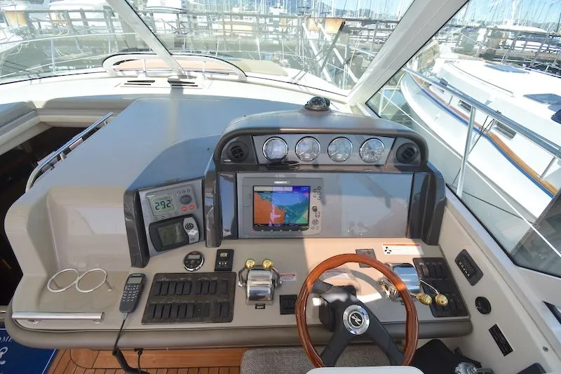 Slide: The Image of 2007 Sea Ray 48 Sundancer helm with navigation system. - 37