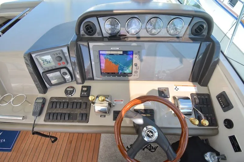 Slide: The Image of 2007 Sea Ray 48 Sundancer helm with navigation system. - 38