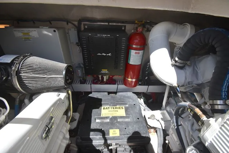 Slide: The Image of Engine room of 2007 Sea Ray 48 Sundancer with battery and fire extinguisher. - 40