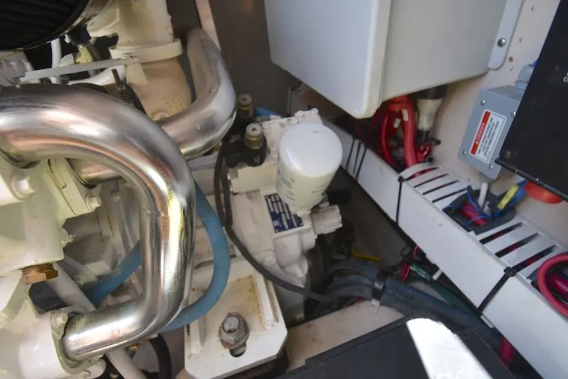 Slide: The Image of Engine room of 2007 Sea Ray 48 Sundancer with cables and pipes. - 49