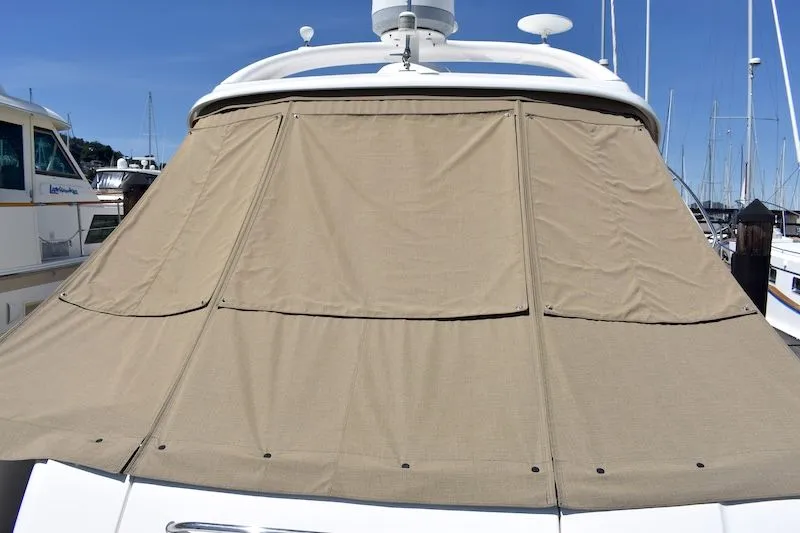 Slide: The Image of 2007 Sea Ray 48 Sundancer with cover in marina. - 8
