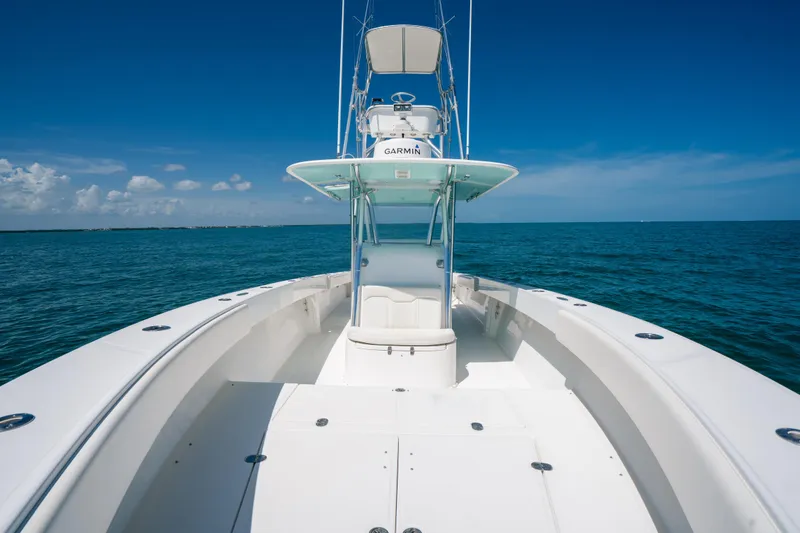 Slide: The Image of 2006 Venture 39 Open boat on calm ocean under clear blue sky. - 13