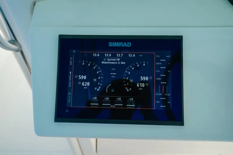 Slide: The Image of Simrad display on 2006 Venture 39 Open boat showing system status and RPM. - 25