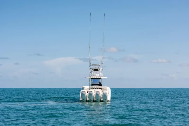 Slide: The Image of 2006 Venture 39 Open boat on calm ocean under clear blue sky. - 41