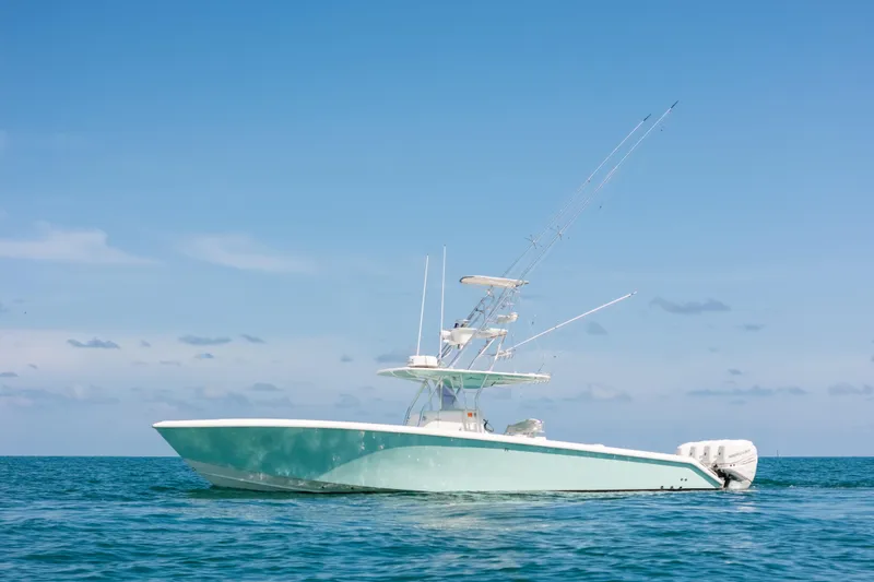 Slide: The Image of 2006 Venture 39 Open boat on calm ocean under clear blue sky. - 5